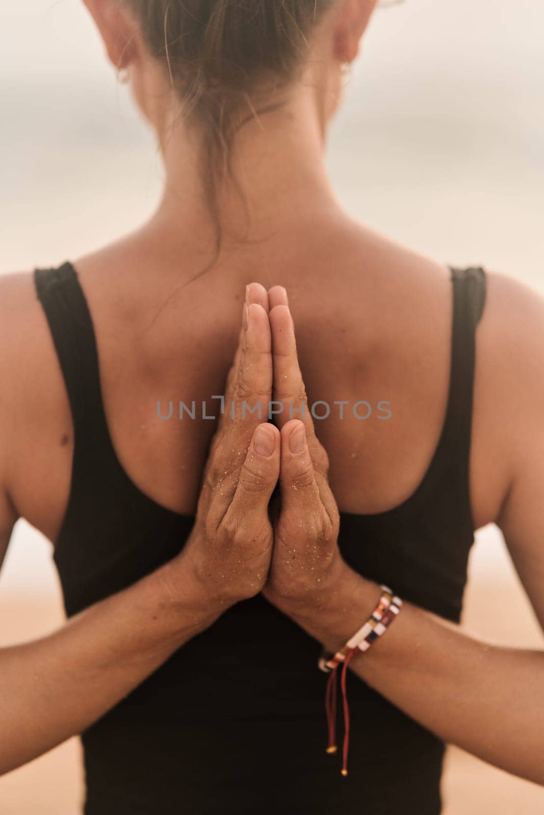 Beautiful girl doing yoga at the beach. High quality photo
