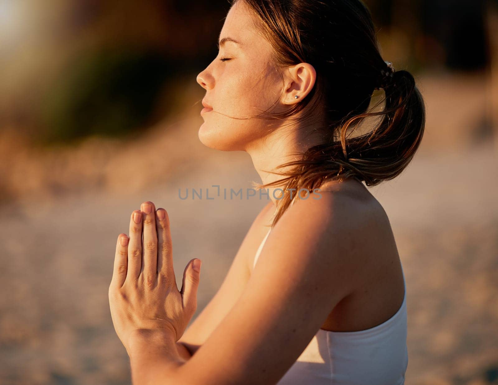 Yoga meditation, prayer hands and profile of woman outdoors for health and wellness. Zen chakra, pilates fitness and female yogi with namaste hand pose for praying, training and mindfulness exercise. by YuriArcurs