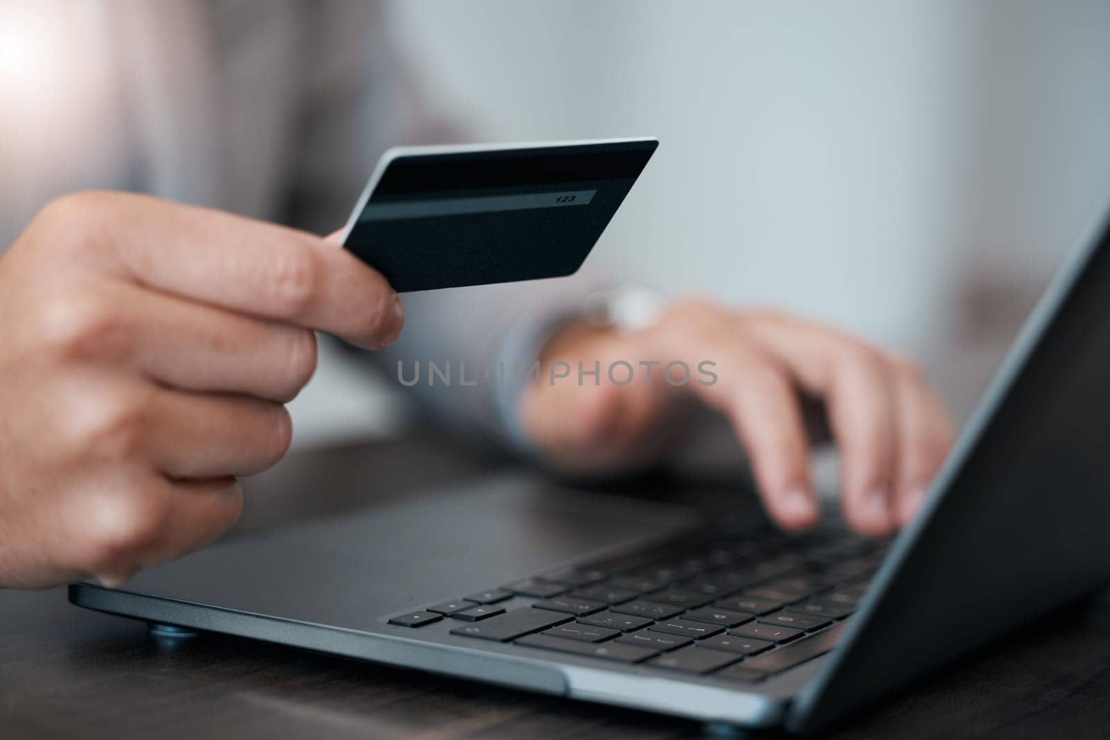 Man hands, laptop and ecommerce credit card business payment technology. Customer check digital banking app, secure bank payment and online retail shopping internet or 5g fintech trading by YuriArcurs