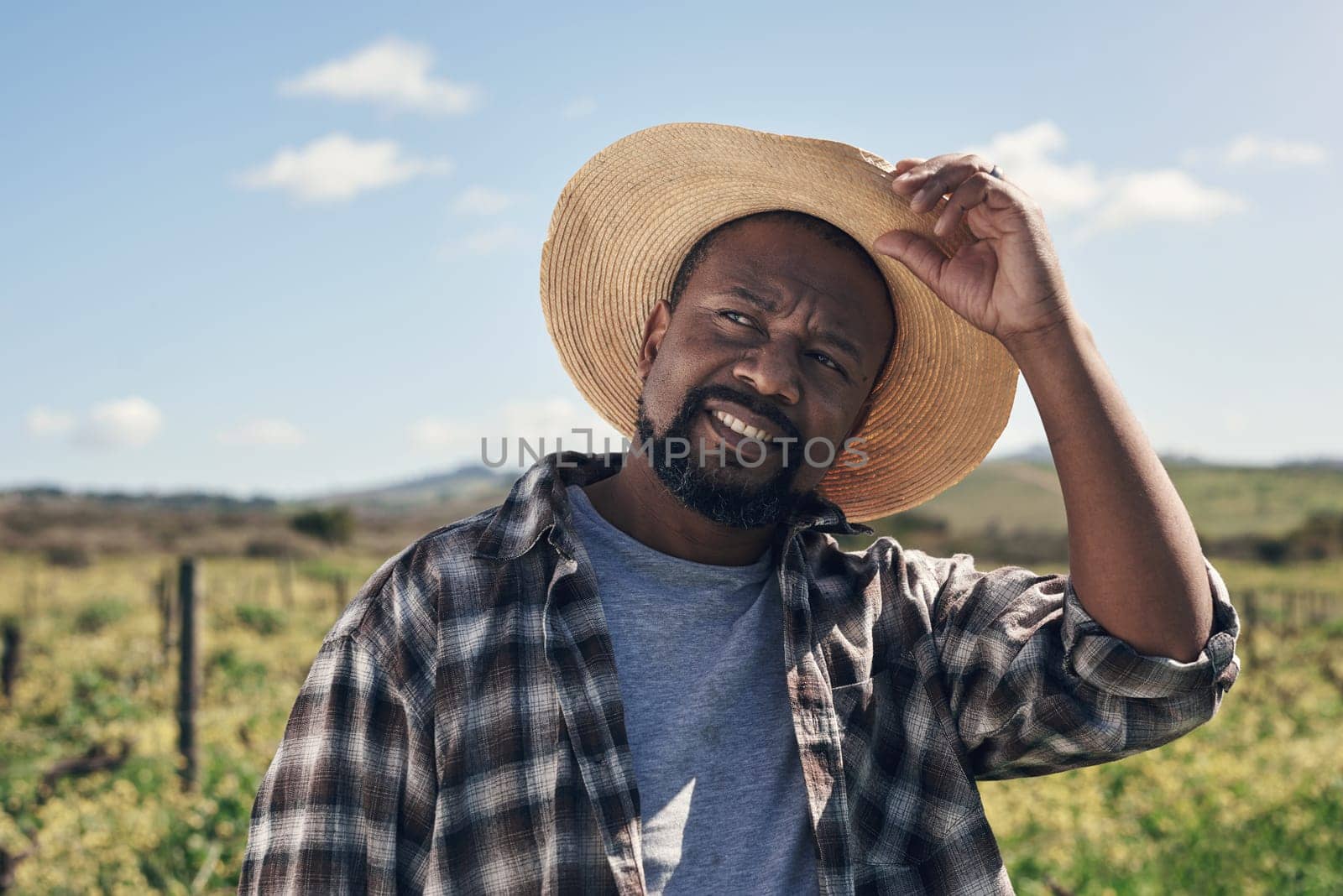 Farmers make the best weather forecasters. a mature man working on a farm. by YuriArcurs