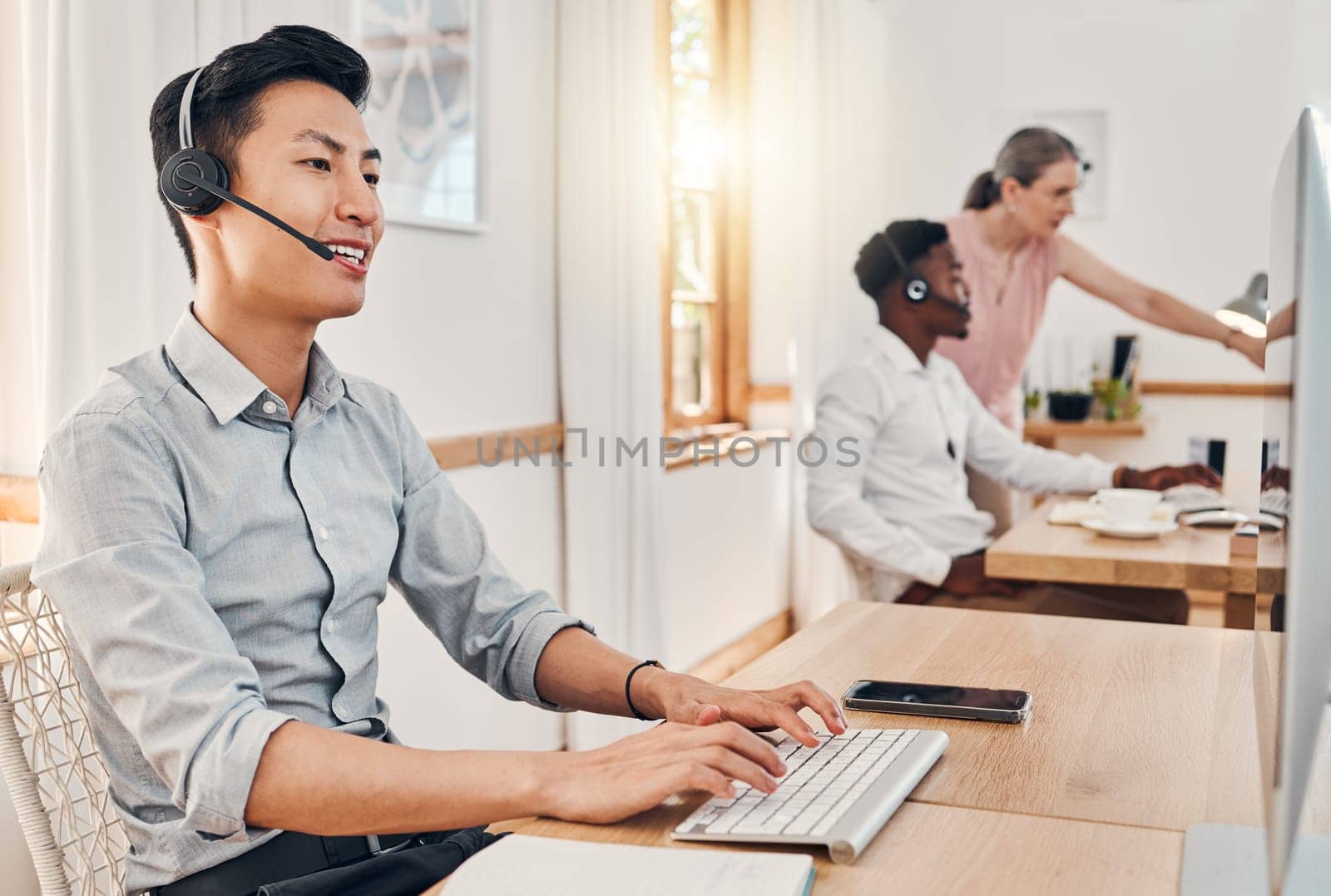 Call center worker, contact us and telemarketing employee listening to a client giving them their payment data. Ecommerce professional with customer support services on crm while consulting in sales by YuriArcurs