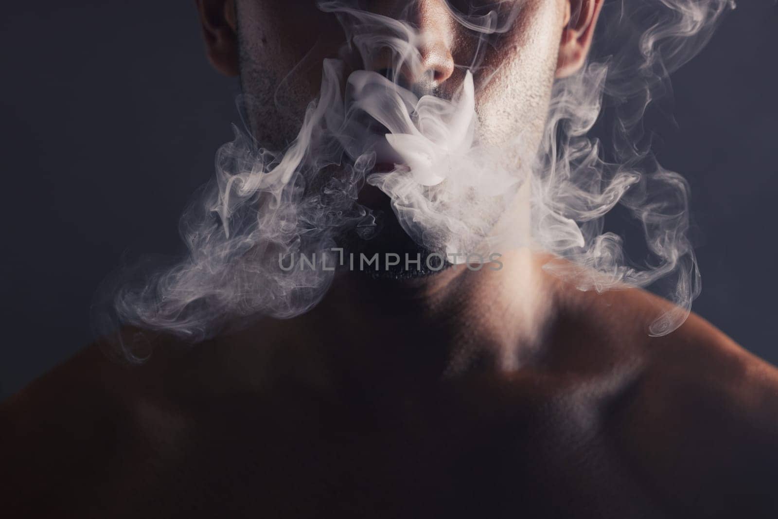 Smoke, cloud and face of man with pollution for marijuana smoker health campaign with zoom. Cannabis, weed and cbd addiction model for smoking habit lifestyle advertising in black studio