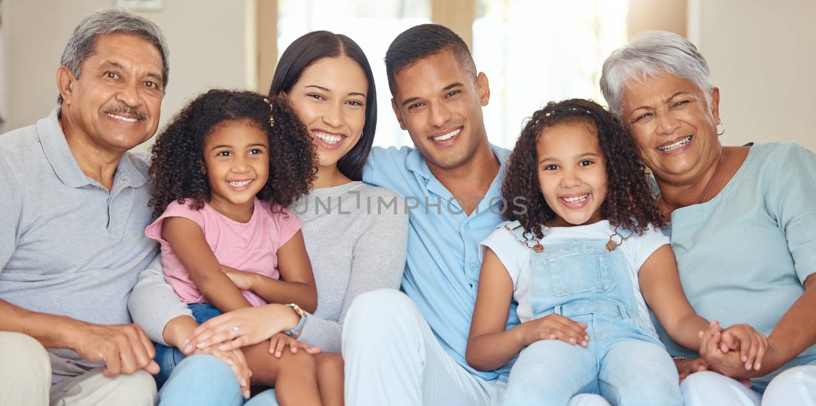 Portrait of happy family time in living room sofa with smile, hug and bonding for love, relax and happiness. Grandparents, parents and children together relaxing in family home, home or house.