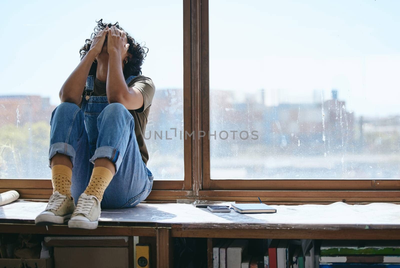 Burnout, anxiety and fatigue creative student frustrated lack of inspiration, studying or learning problem in university classroom. College woman by window crying, stress or mental health depression by YuriArcurs