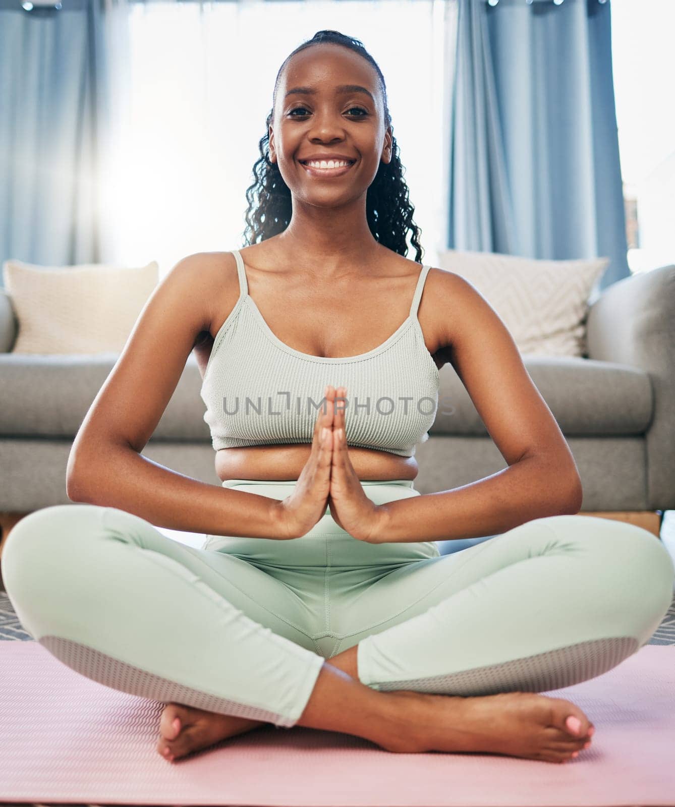 Yoga, namaste woman and zen portrait in living room for fitness, exercise and mindfulness, healing or peace. Meditate, spiritual and black person praying or prayer hands for happy, self care wellness.