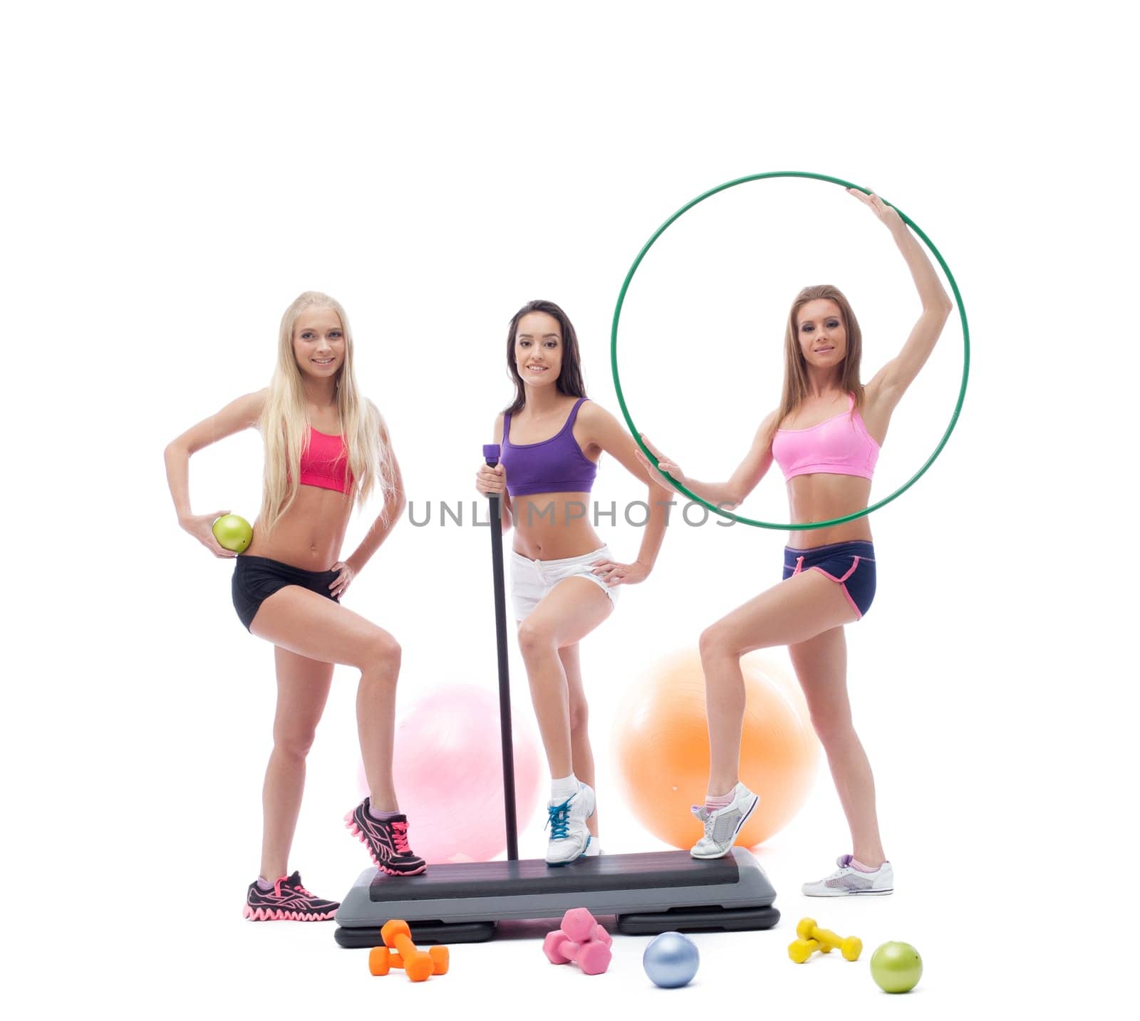 Cute female athletes posing with sports equipment by rivertime