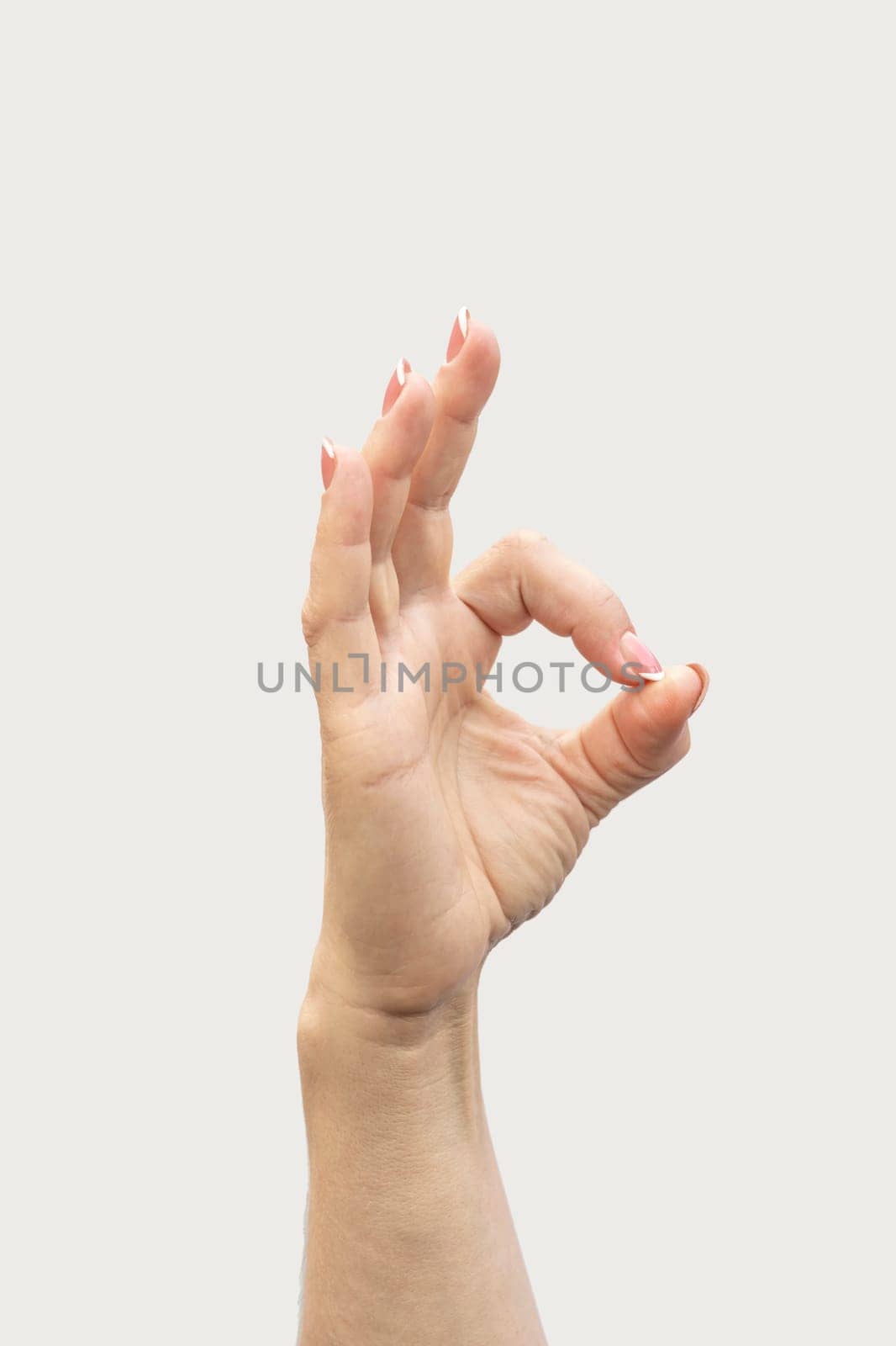 gesture of a woman's hand on a white background isolate. photo