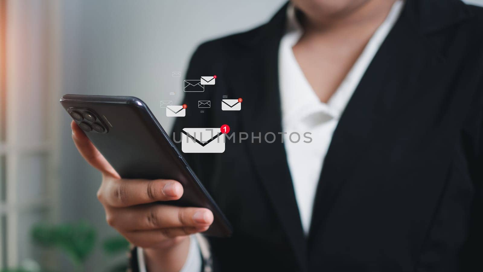 Businessman checking email on mobile phone. New email notification ideas for business email communication and digital marketing. The inbox receives electronic message notifications. internet technology by Unimages2527