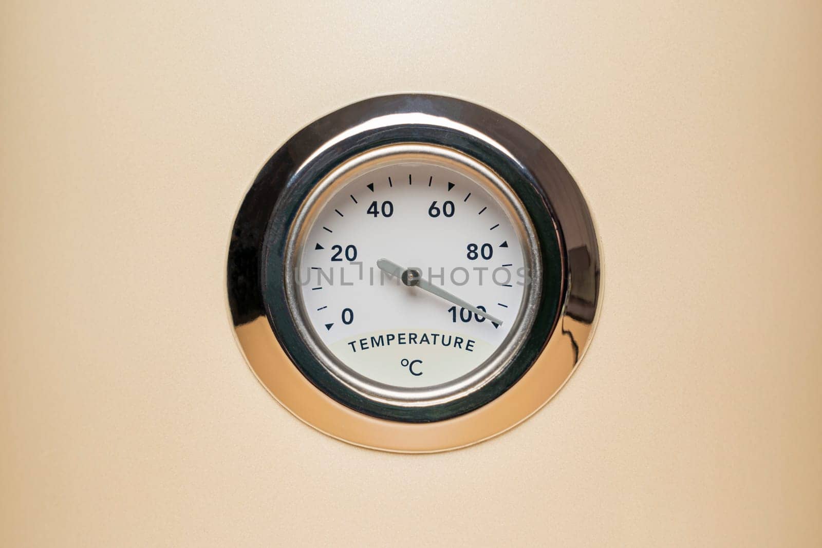 the mechanical thermometer shows 100 degrees Celsius. photo