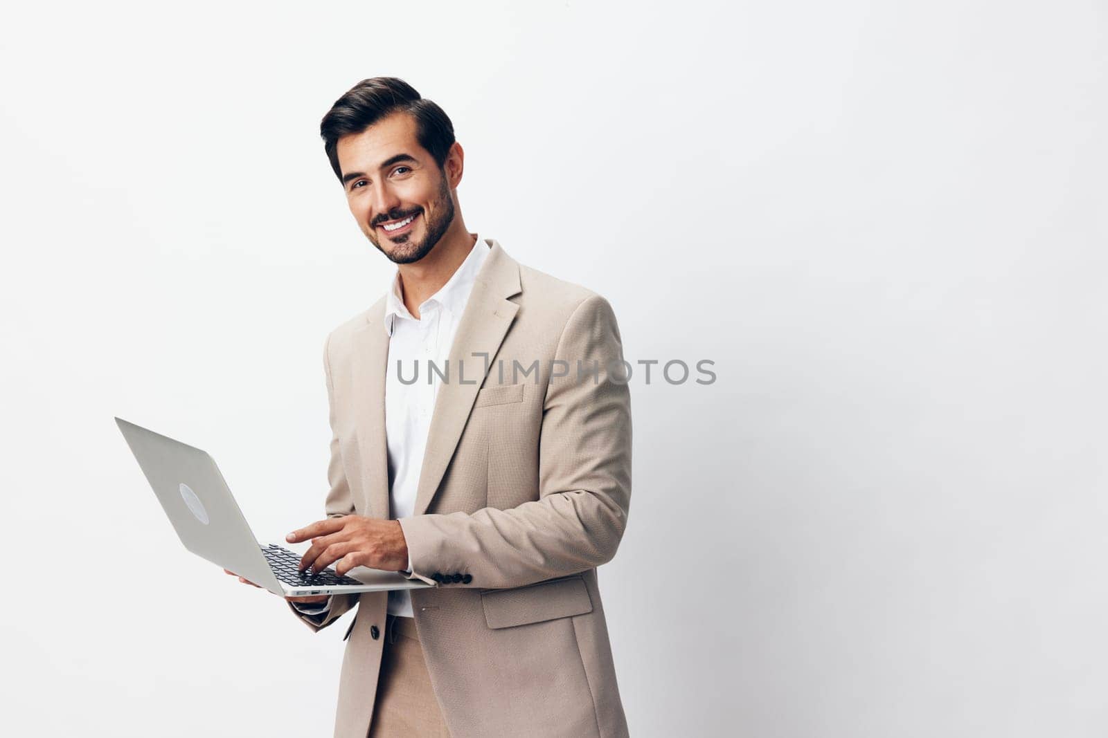 laptop man internet computer suit freelancer happy business job copyspace smiling by SHOTPRIME