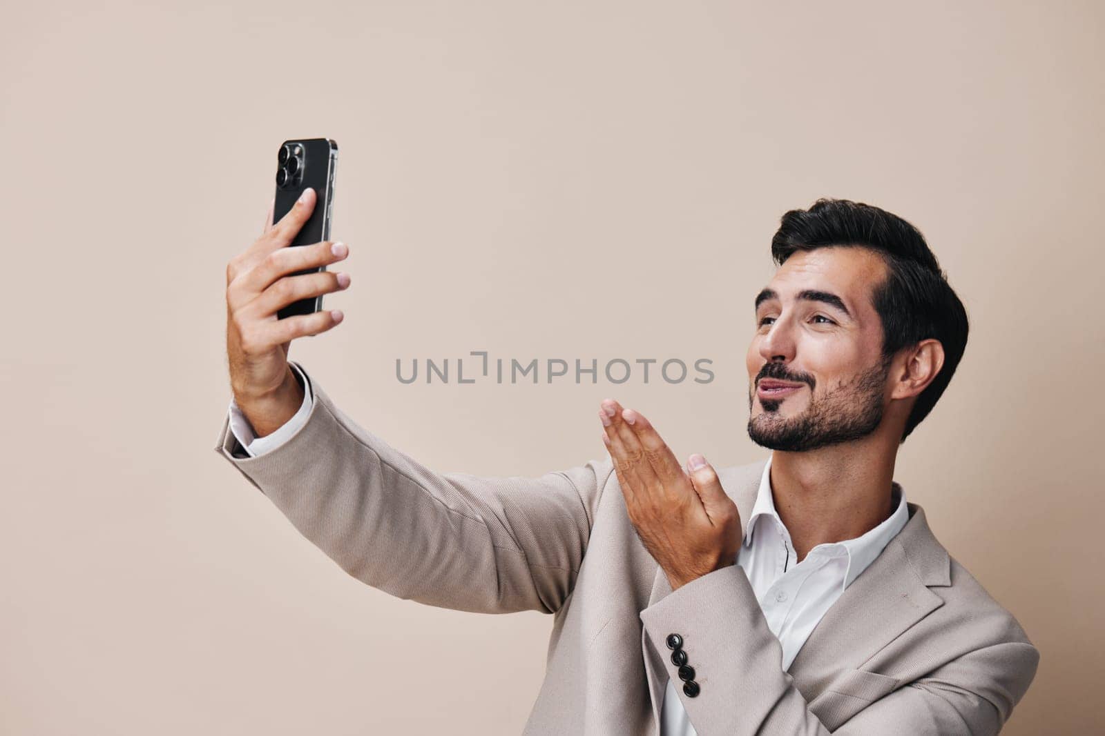 phone man copy application gray smartphone portrait suit hold male entrepreneur isolated cell lifestyle call business happy smile blogger young space background