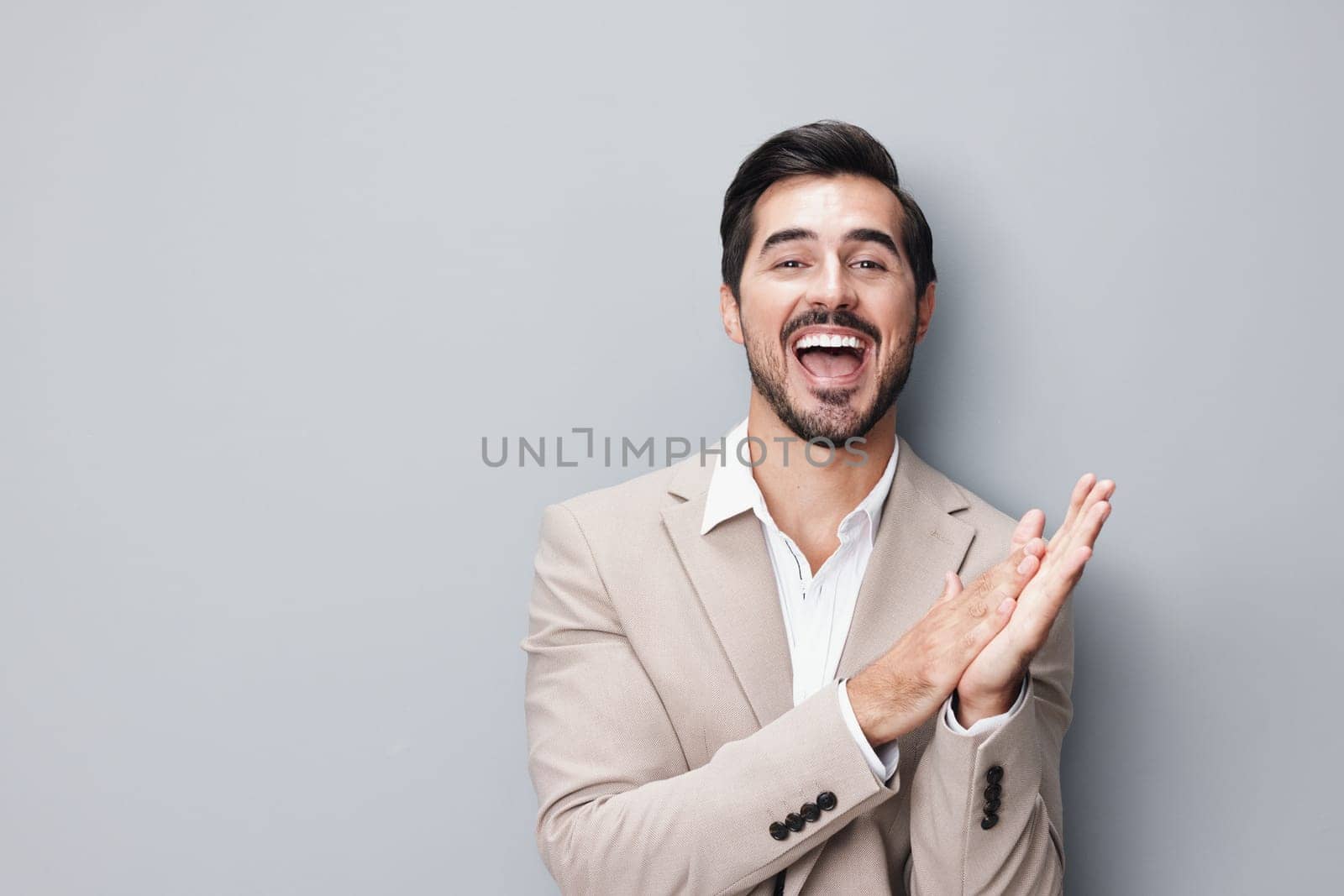 man male smiling handsome eyeglass businessman happy portrait beard young folded copyspace background business attractive corporate isolated formal beige suit arm