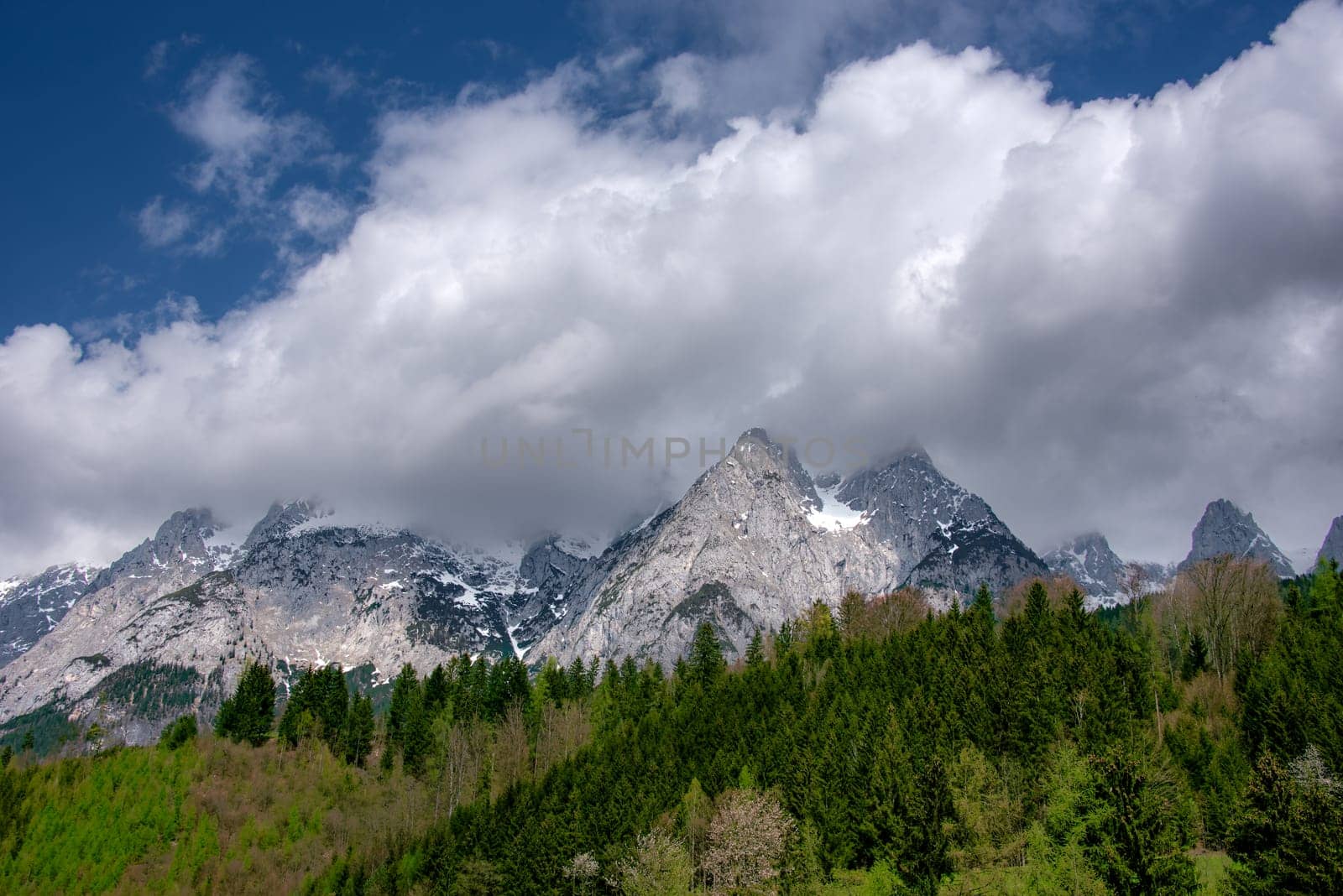 Cloudy mountain pick in Austrian alps by Millenn
