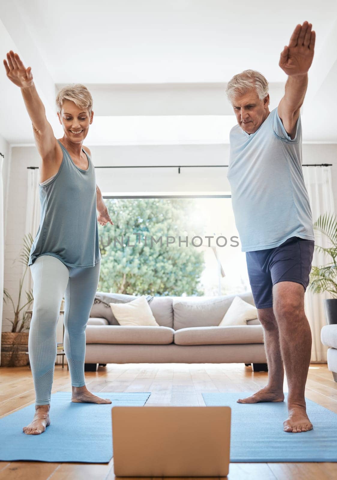 Yoga stretching, laptop and senior couple in a video call class for retirement wellness, workout motivation and pilates exercise in Dallas home. Healthy elderly people in cardio with online support.