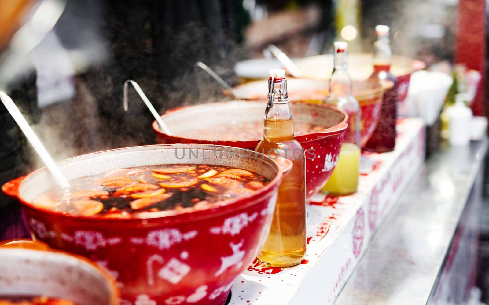 Hot mulled wine on a street food market by GekaSkr
