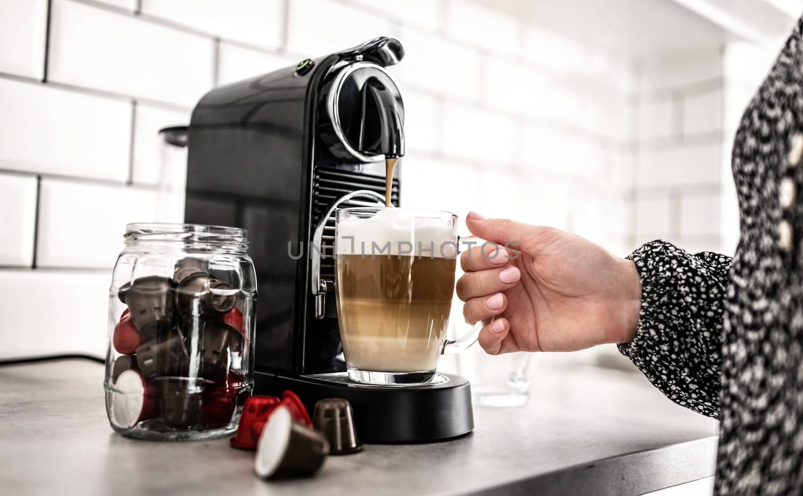 Capsule coffee machine at domestic kitchen by GekaSkr