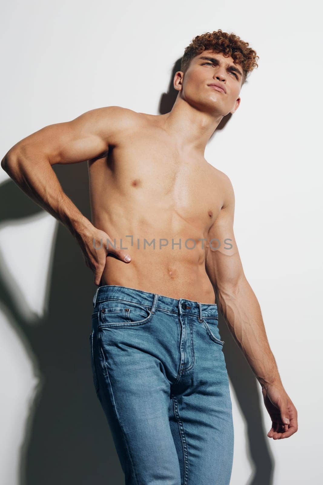 man chest young athlete body naked attractive white background torso jeans sexy health sport standing