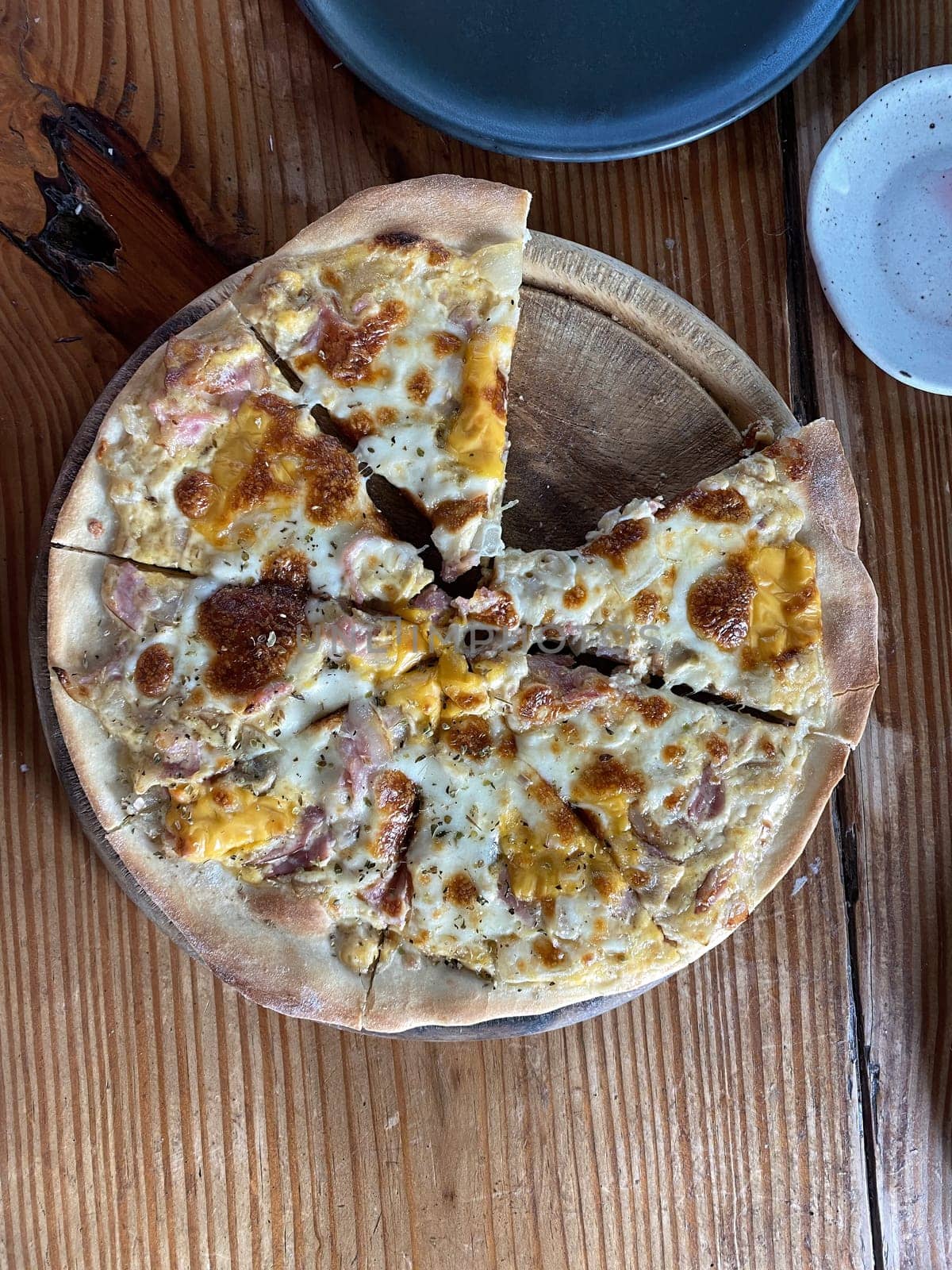 homemade pizza not full on wood table, italian fast food kitchen and eating concept. close up of homemade pizza on wooden table