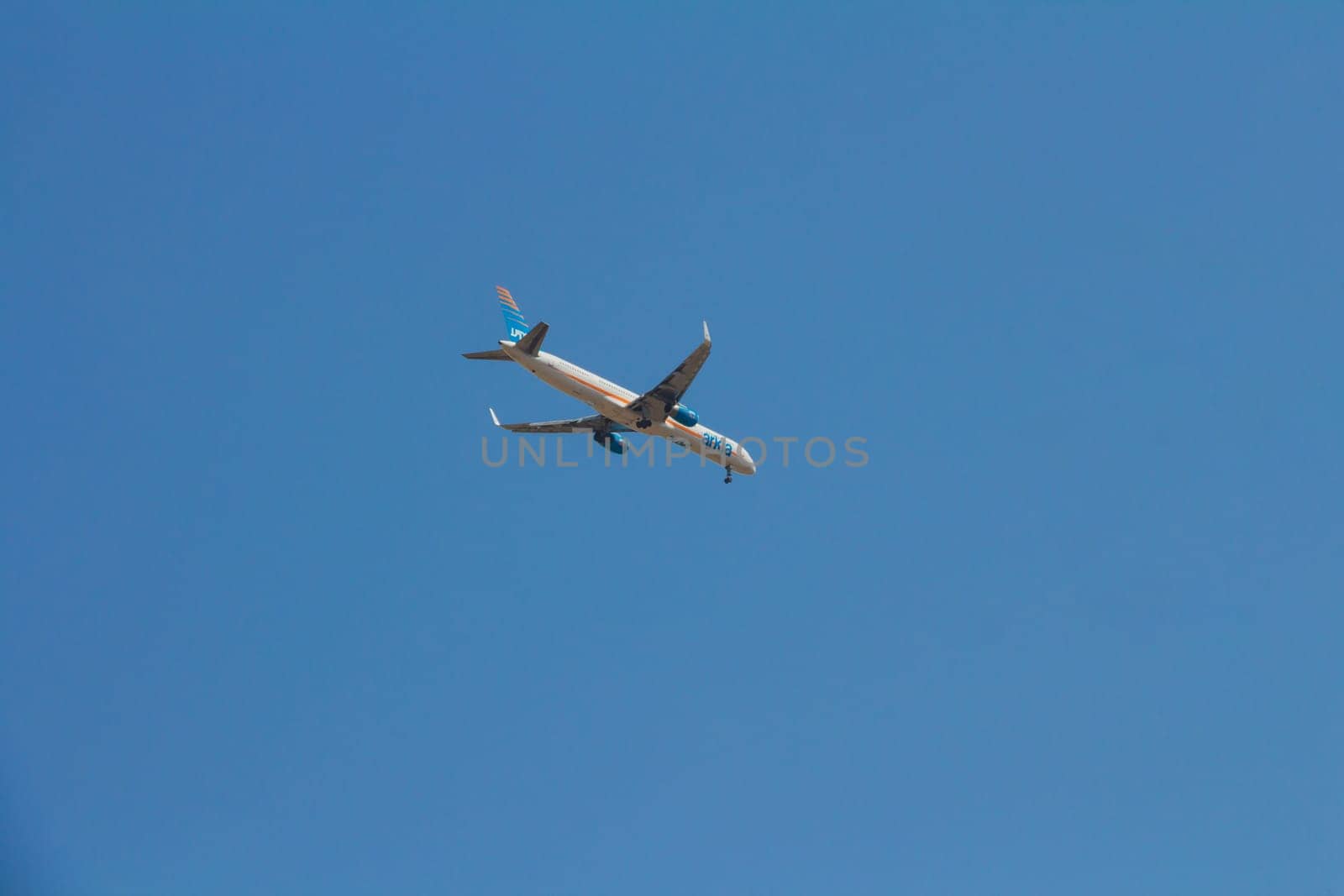 Tel aviv, Israel - October 7, 2017: Arkia airline commercial plane flying in the blue sky going for a landing. Arkia is an Israeli airline.