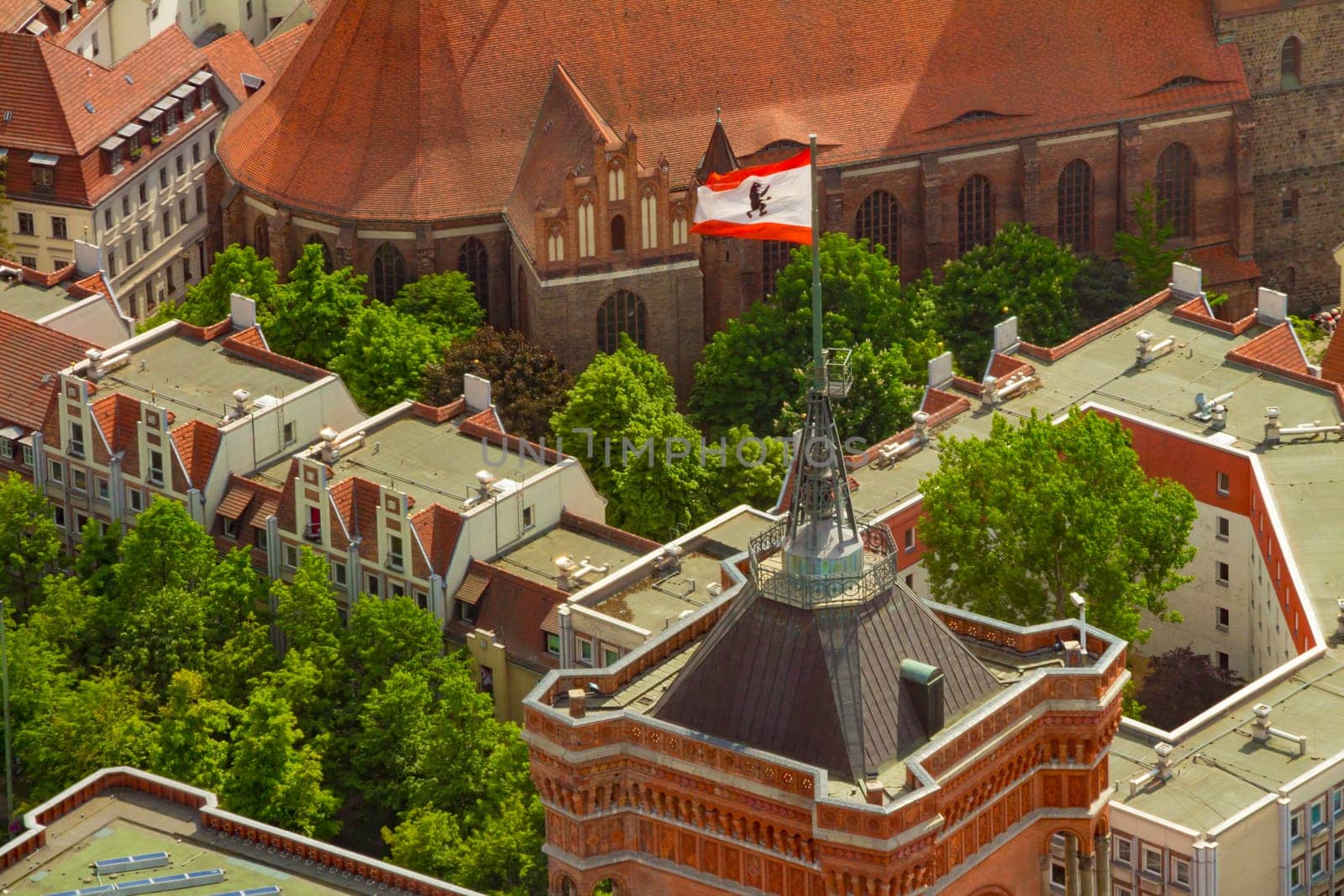 Aerial view of the flag of berlin on the top of Rotes Rathaus (Red City Hall) building.
