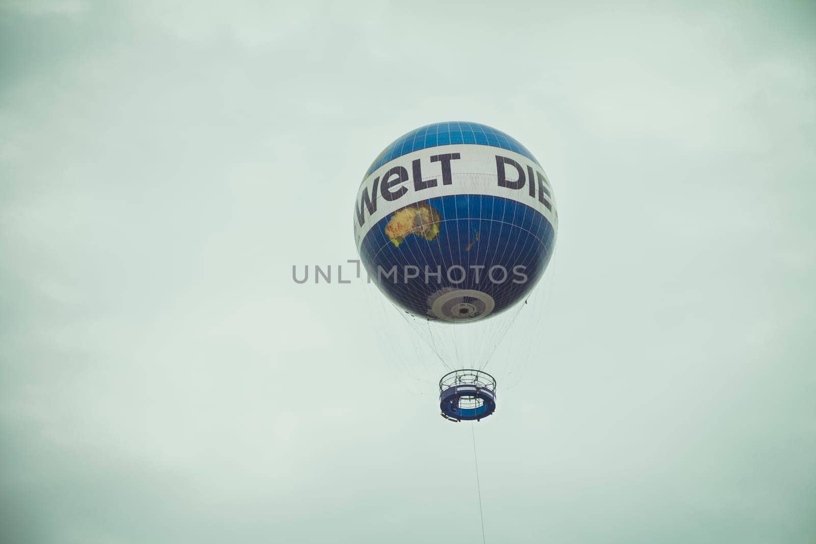 Hot air balloon fly in the sky of Berlin city. Hiflyer (Highflyer) Air Service operate the World Balloon Berlin with Die Welt advertising.