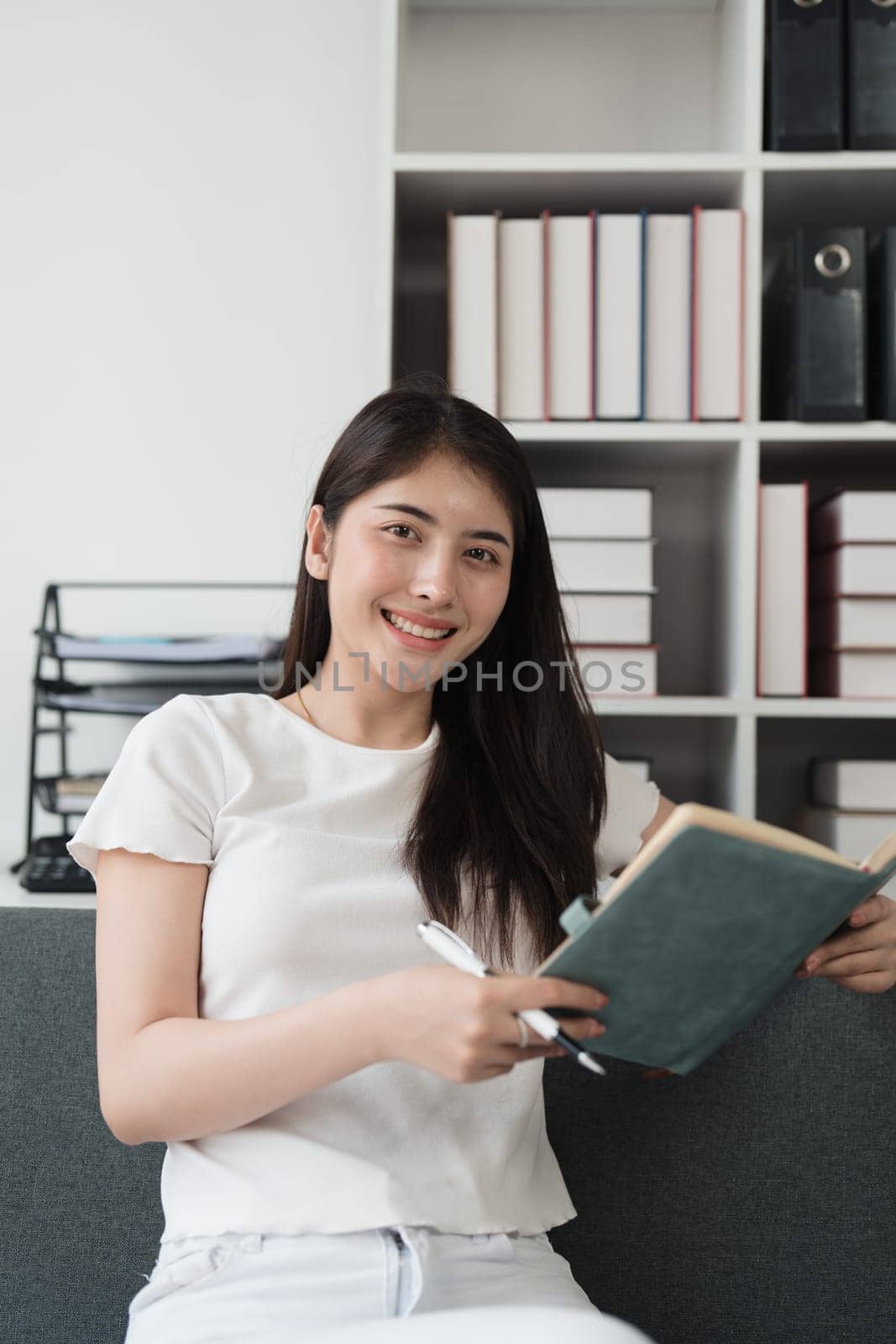 Attractive Asian woman resting comfortable living room and reading book, Relax, Sofa, Lifestyle.