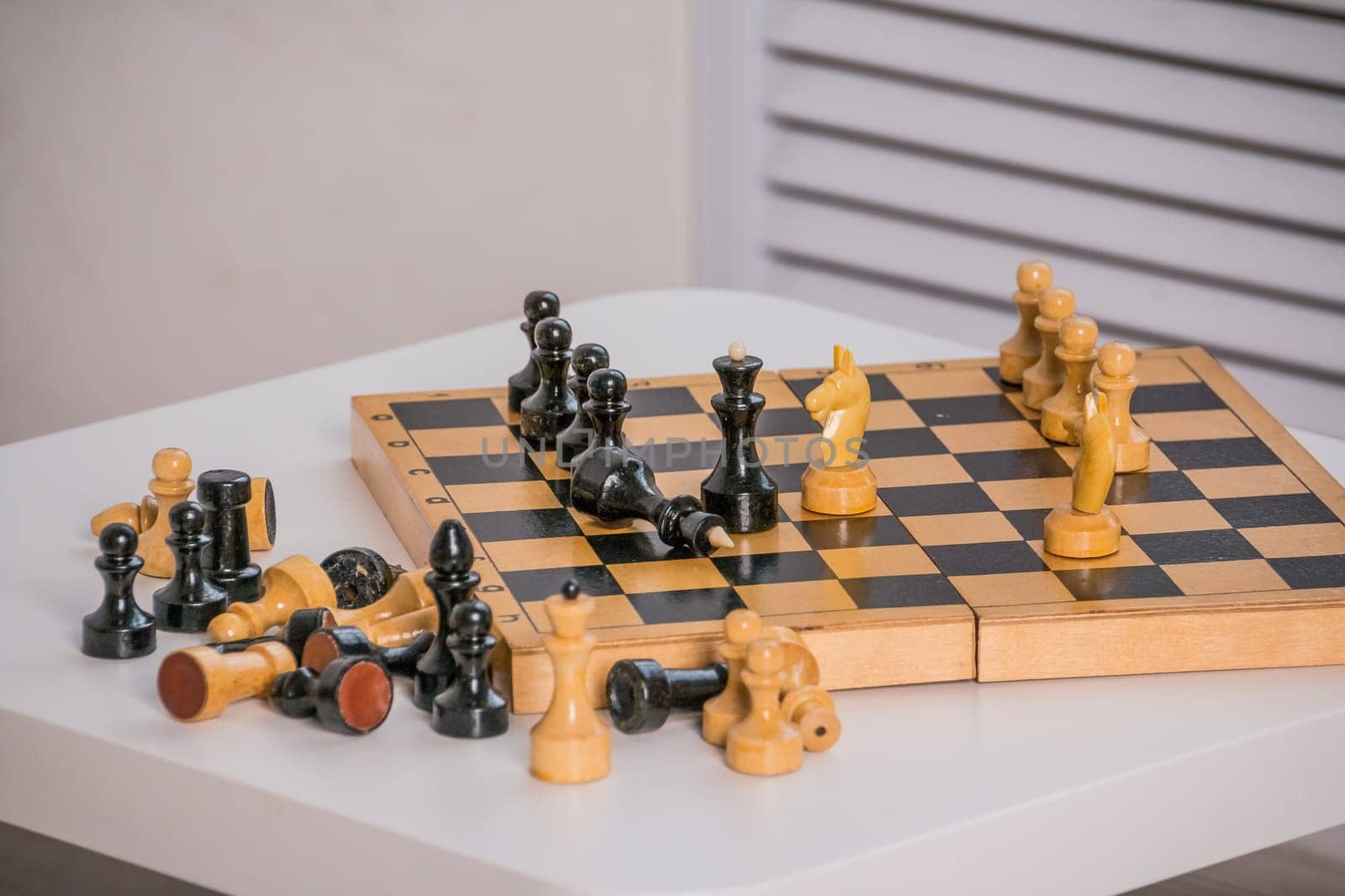 wood chess pieces on board game. brown vintage background