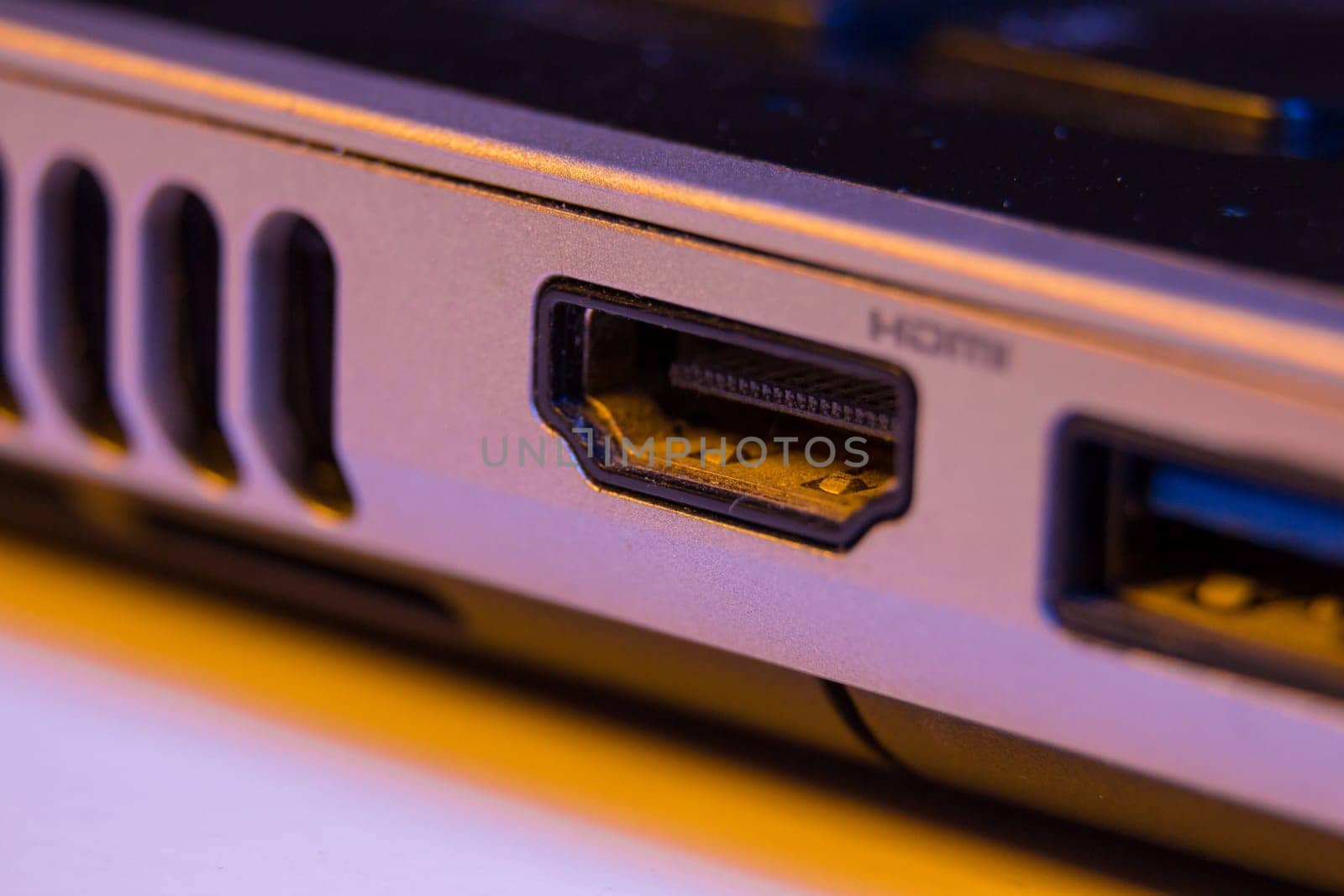 Closeup of HDMI cable port in a laptop.