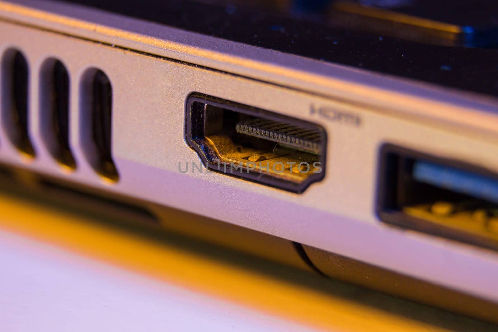 Closeup of HDMI cable port in a laptop.