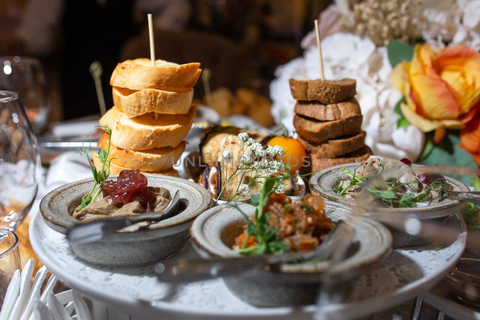 assorted snacks with bruschetta and pate on the festive table.