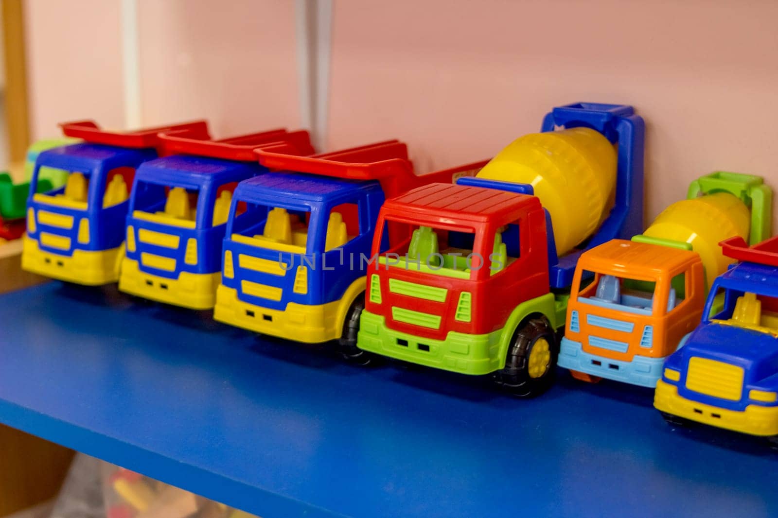 Color toy car. Colorful toy truck isolated on white background. Plastic car.