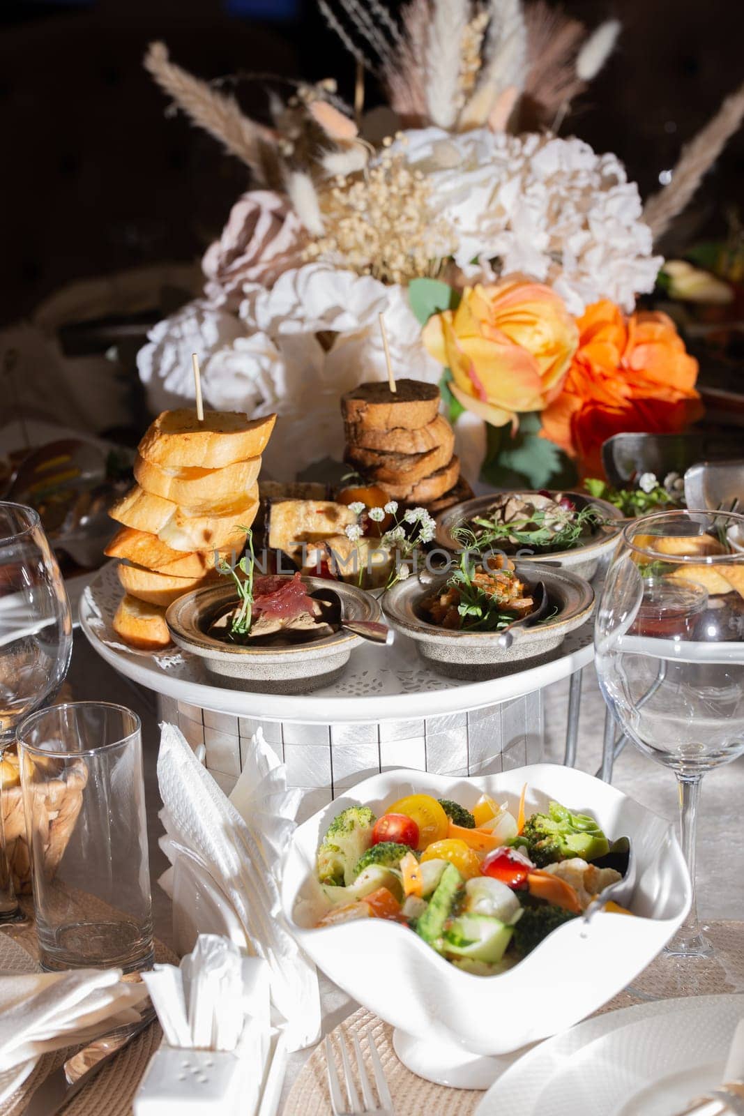 assorted snacks with bruschetta and pate on the festive table.