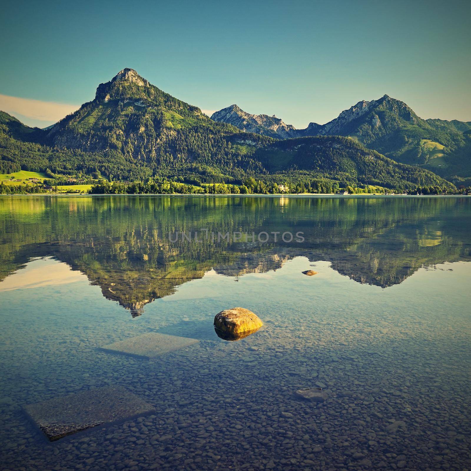 Beautiful landscape with lake and mountains in summer. Natural colorful background. Wolfgangsee lake in the Austrian applause. by Montypeter