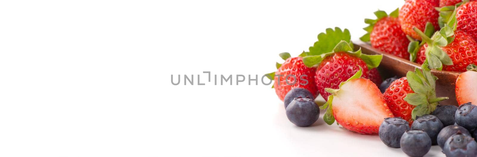 A bowl set of beautiful and delicious strawberry and blueberry isolated on white background, close up, copy space, clipping path, cut out. by ROMIXIMAGE