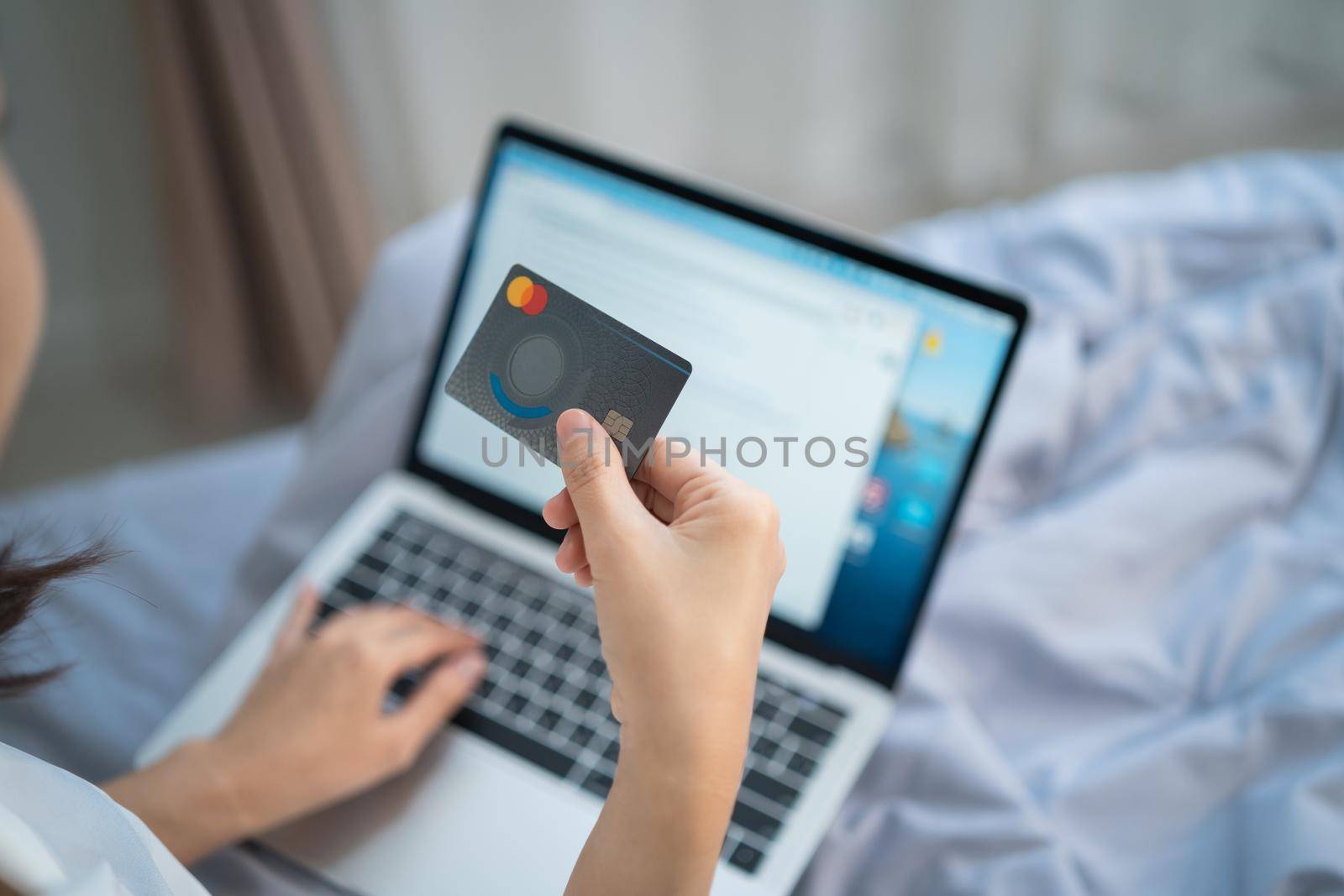 woman using laptop and credit card shopping online, business shopping online concept by Wmpix