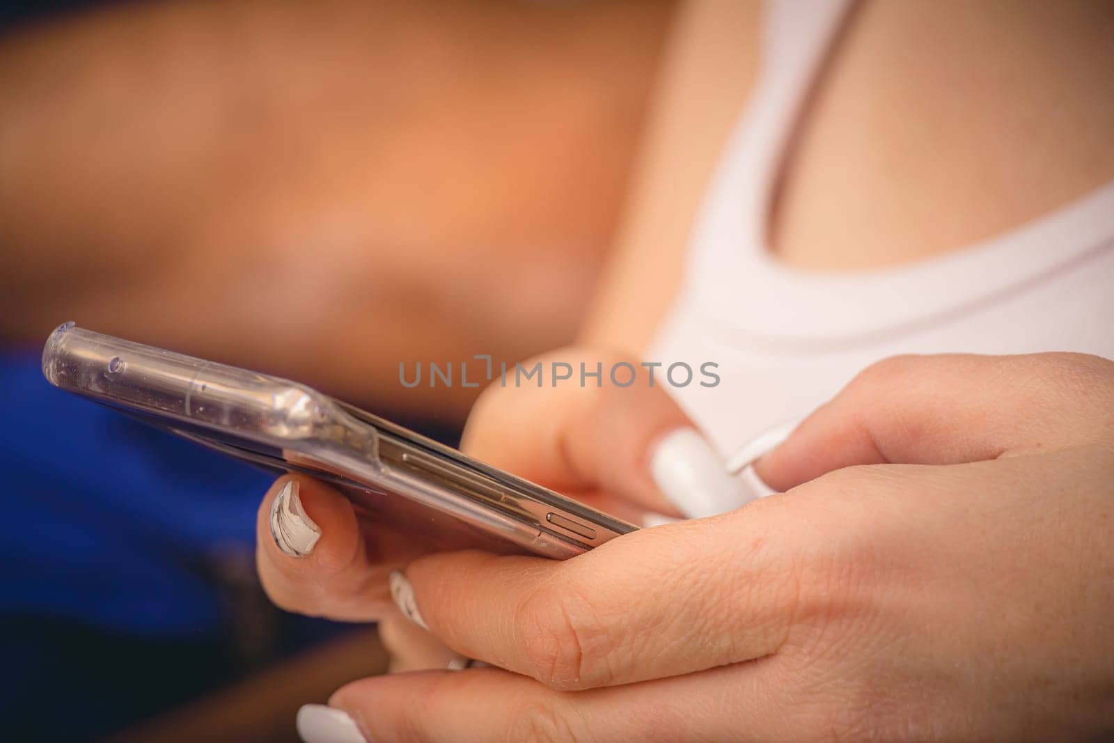 Young woman using a smartphone. Close up, selective focus with copy space.