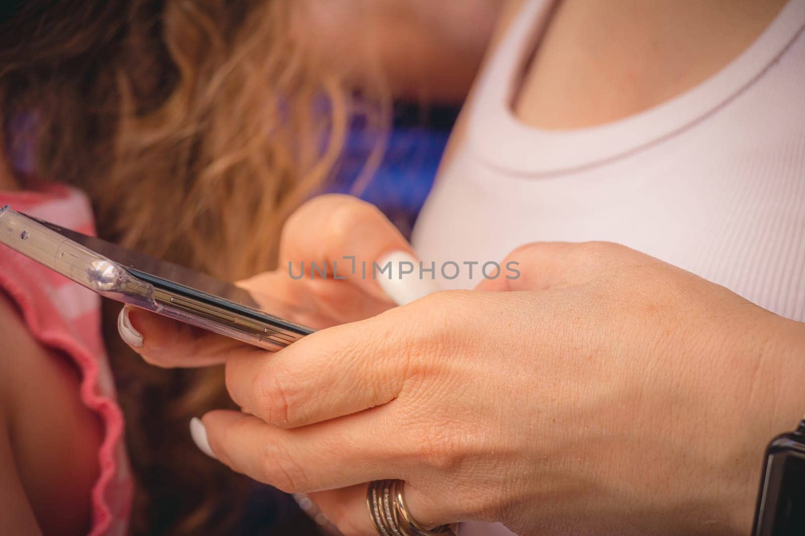Young woman using a smartphone by wavemovies