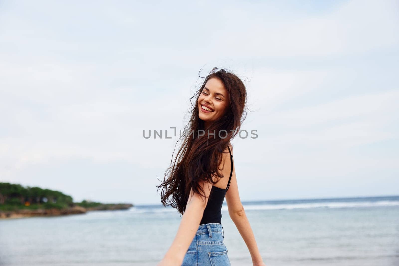 woman young summer tan travel lifestyle running sea beach smile sunset by SHOTPRIME