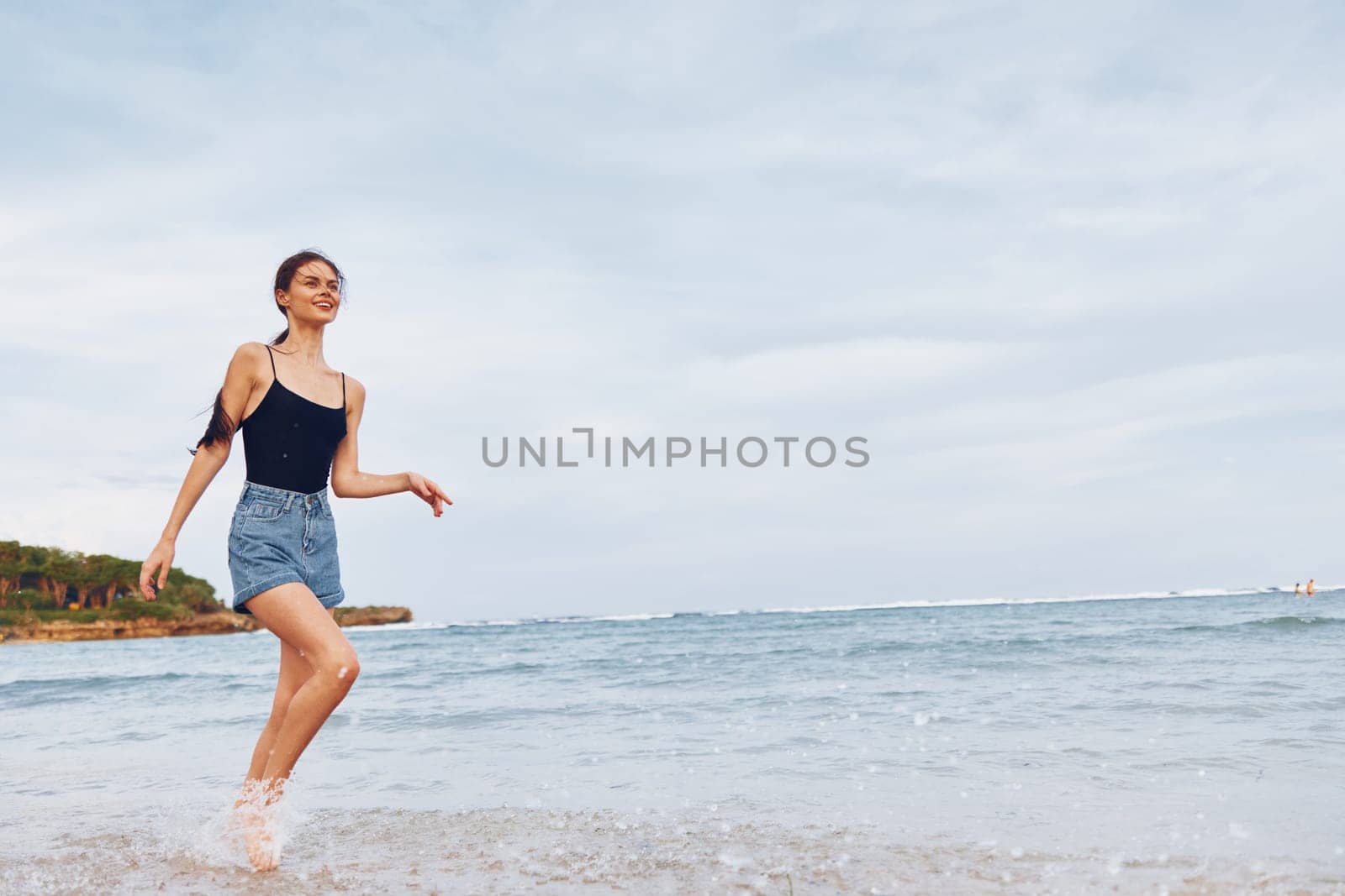 relax woman sea smile beach running sunset positive fun tan hair ocean summer hair long travel lifestyle flight vacation carefree young freedom