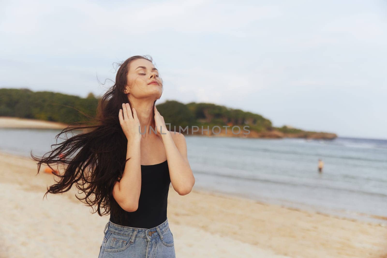 woman vacation girl sunset walk shore ocean outdoor sea summer sand freedom beach happiness lifestyle smiling carefree leisure sun smile person