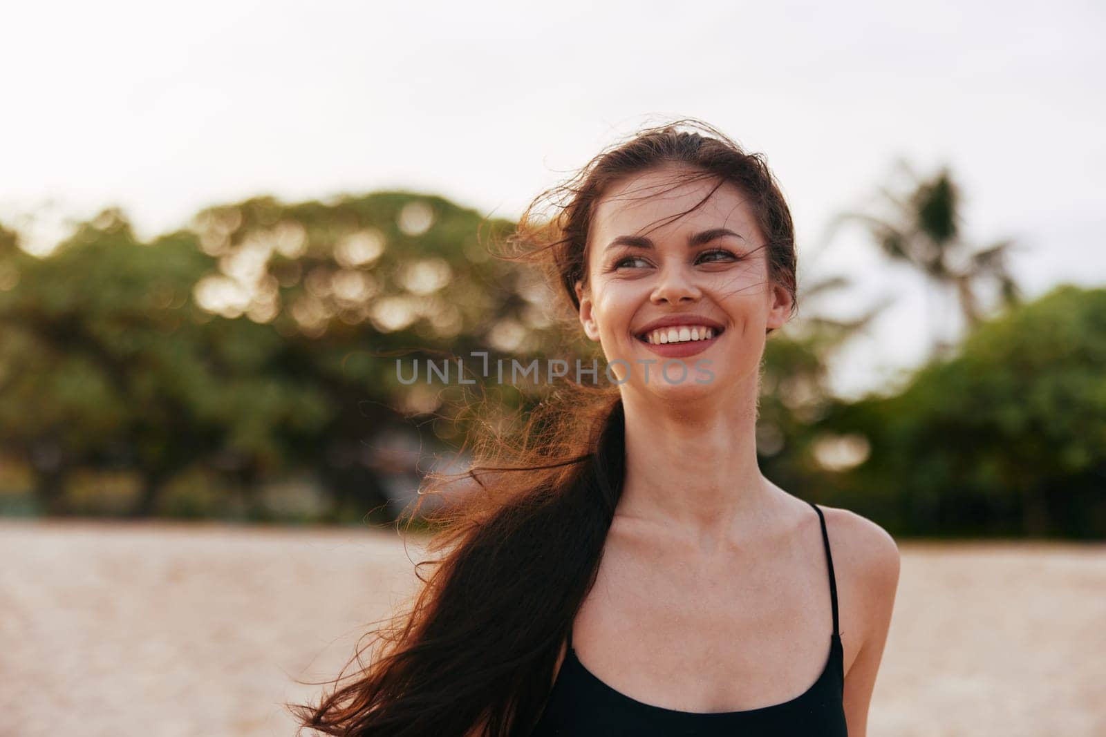 beauty woman sea sand sky lifestyle vacation smile tropical summer outdoor sunset caucasian copy beautiful holiday freedom coast beach ocean space free