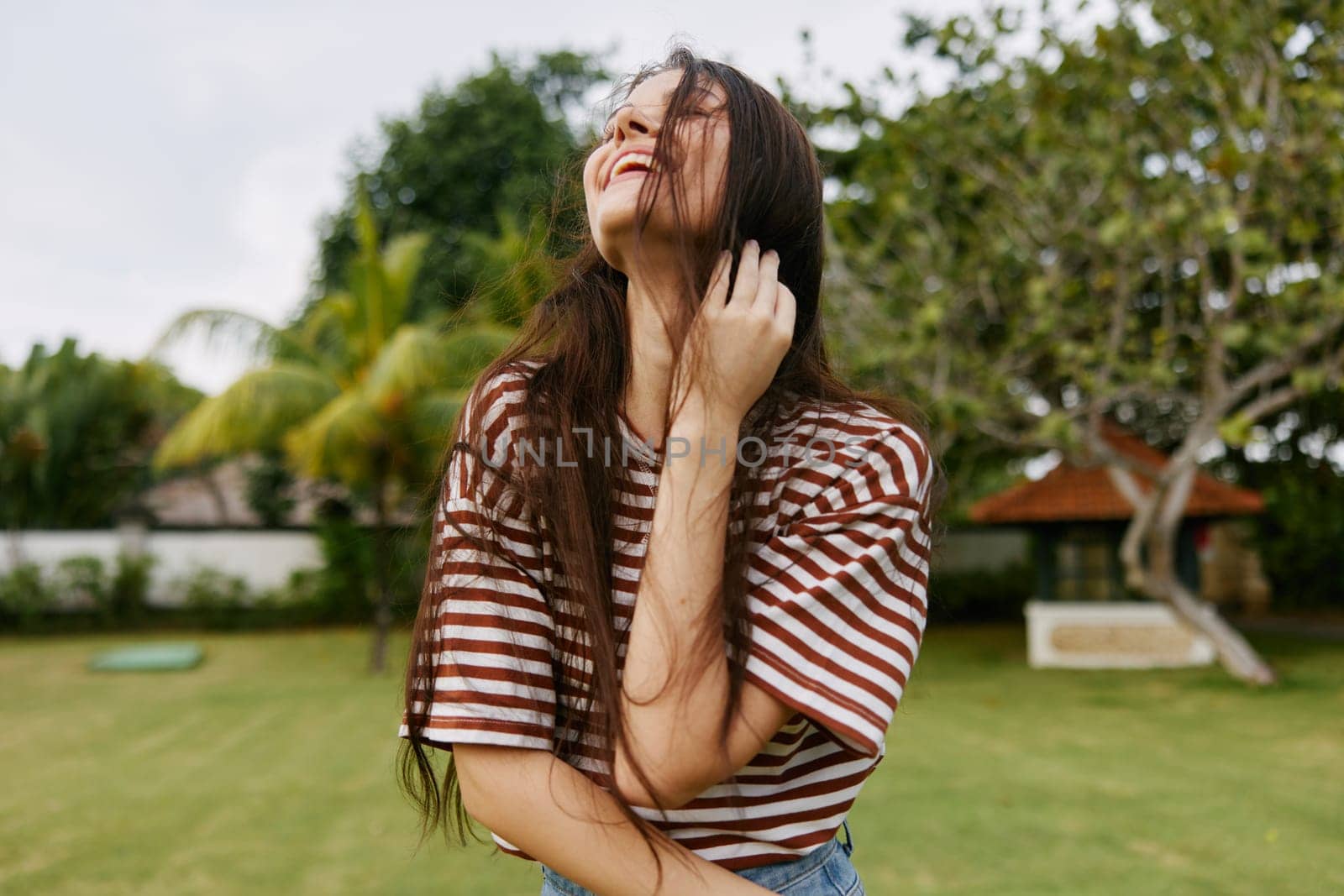 woman lifestyle beautiful day quiet smiling park nature beauty person bali exercise freedom summer sunny outdoor face walk happiness t-shirt wellness