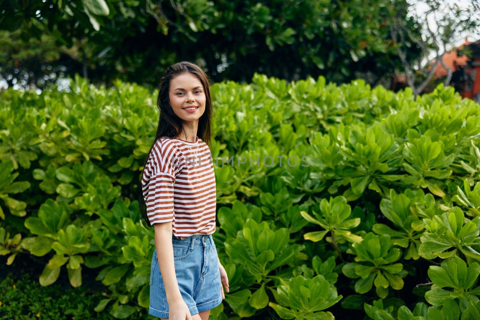 lifestyle woman walk summer nature freedom smiling beautiful park striped t-shirt by SHOTPRIME