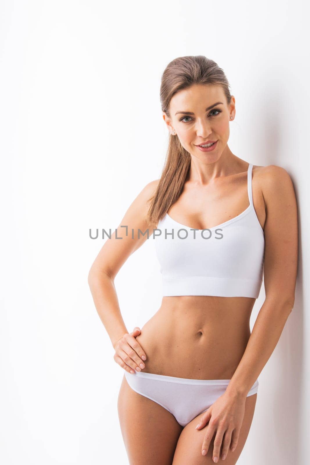 Woman body beauty , girl in cotton underwear , young slim model on white