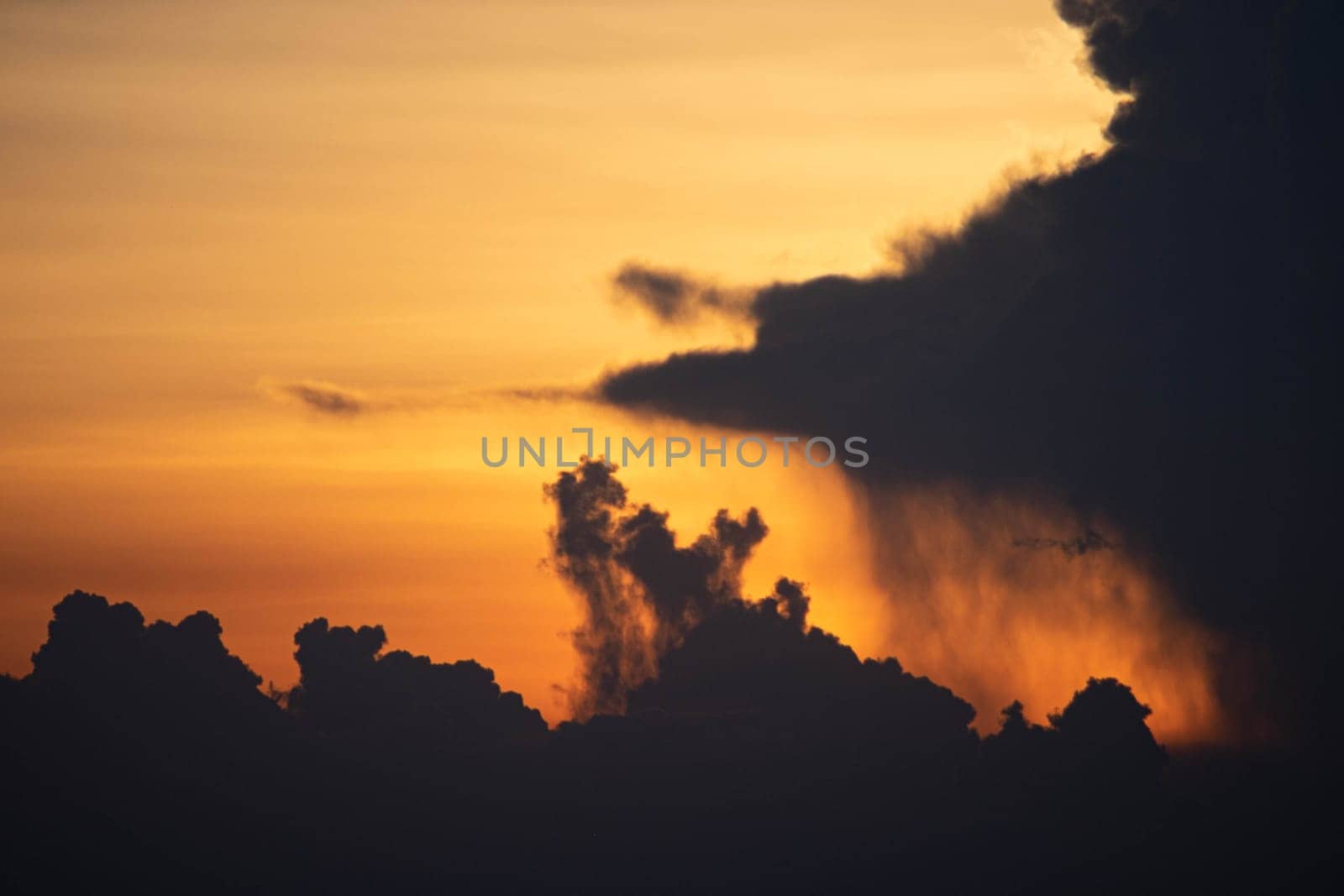 Evening sky sunset.  big puffy cumulus and long stratus clouds. sky background with clouds