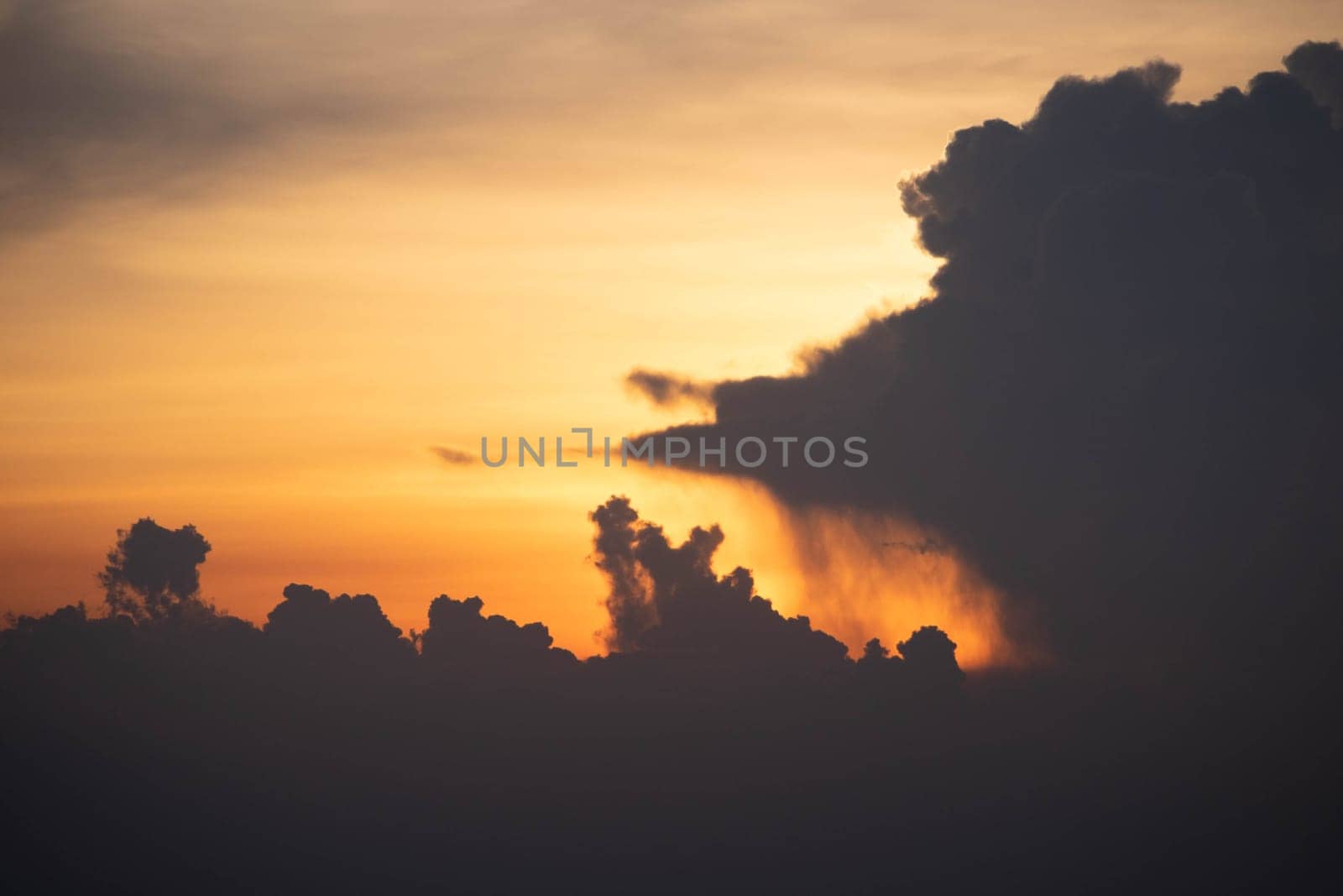 Giant dark cloud. Storm Clouds at Sunset before rain abstract weather environment season.