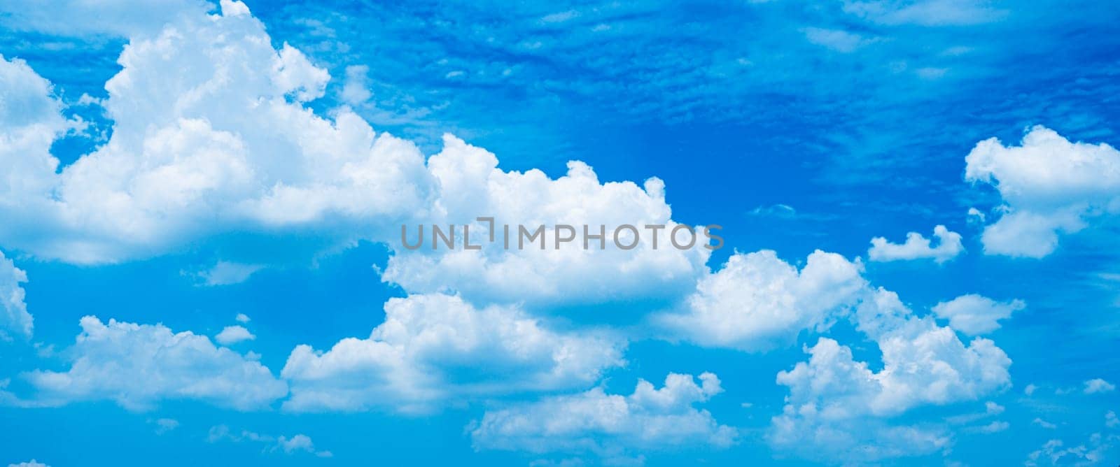 white fluffy clouds sky background with blue sky background for copy space.