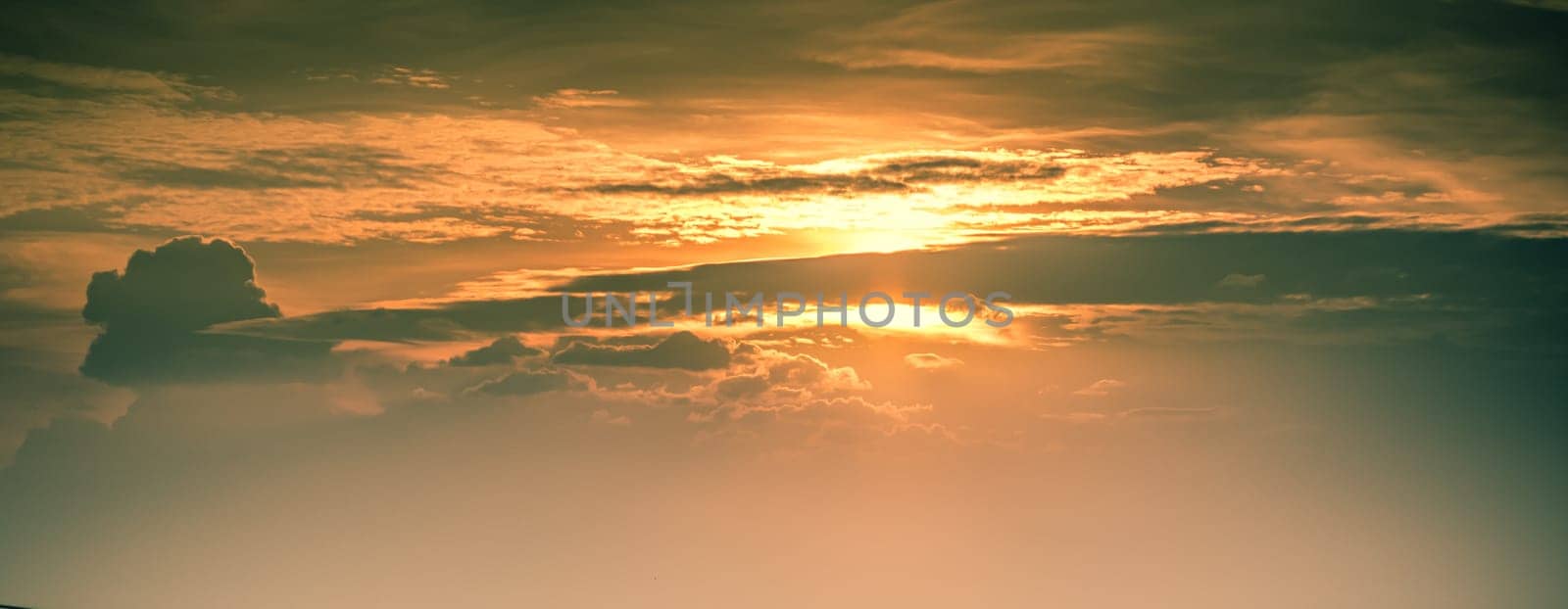 Beautiful sunset sky above clouds. Orange sunset sky. Beautiful sky. Dramatic red yellow pastel color at sunset. by Petrichor
