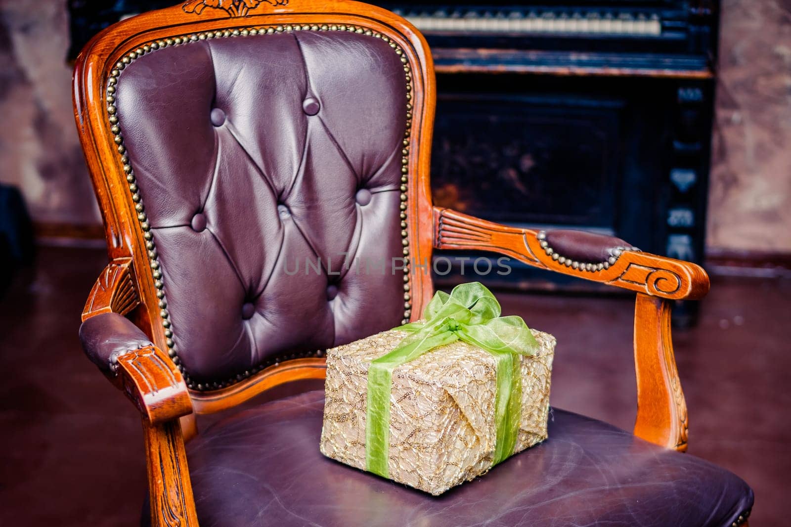 Wrapped gift boxes with ribbons as Christmas presents on a chair