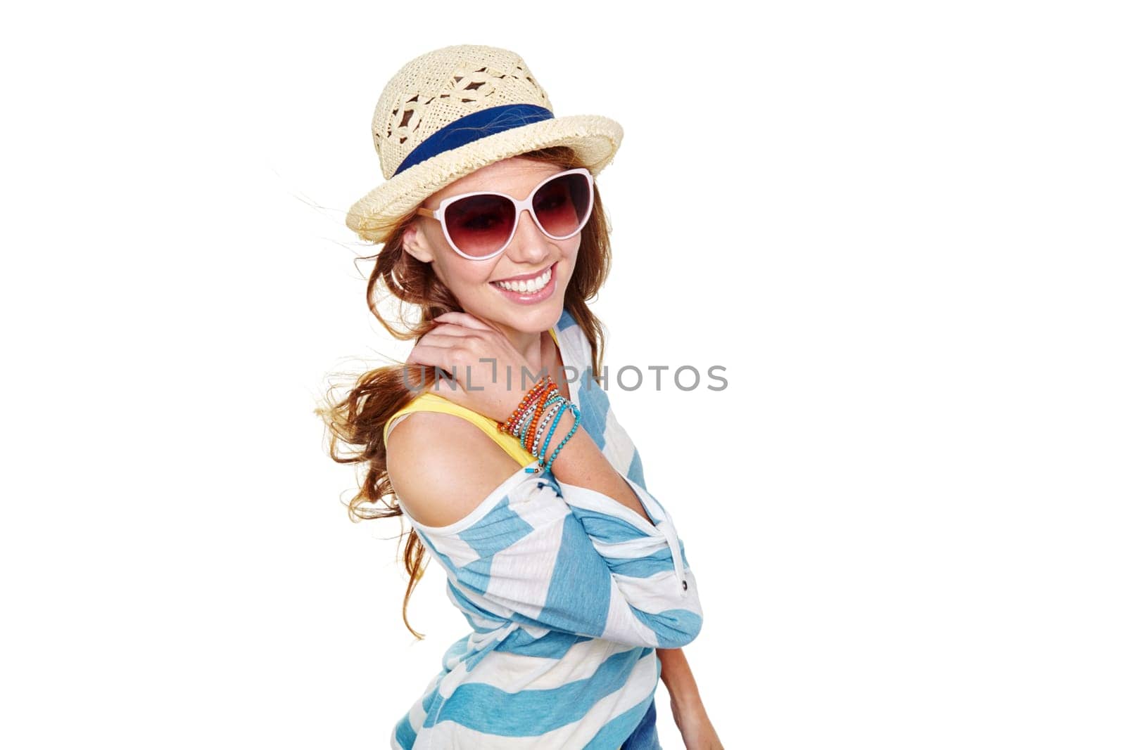 Summer is here I couldnt be any happier. Studio shot of a young woman dressed for summer isolated on white